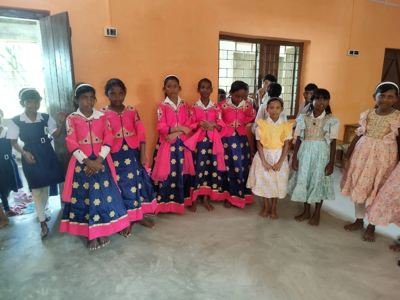 Girls line up in their new dresses