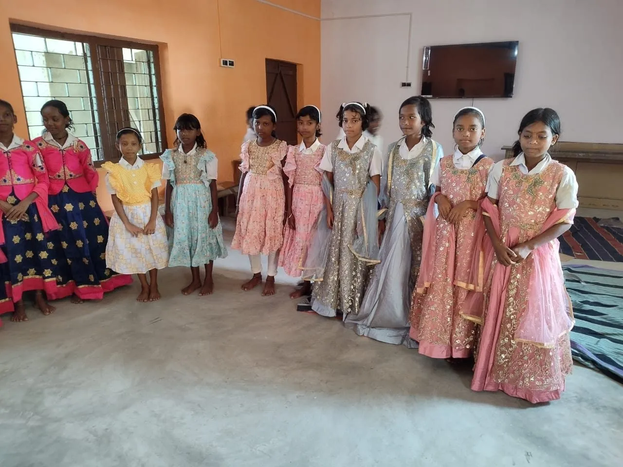 Girls stand together in their new dresses